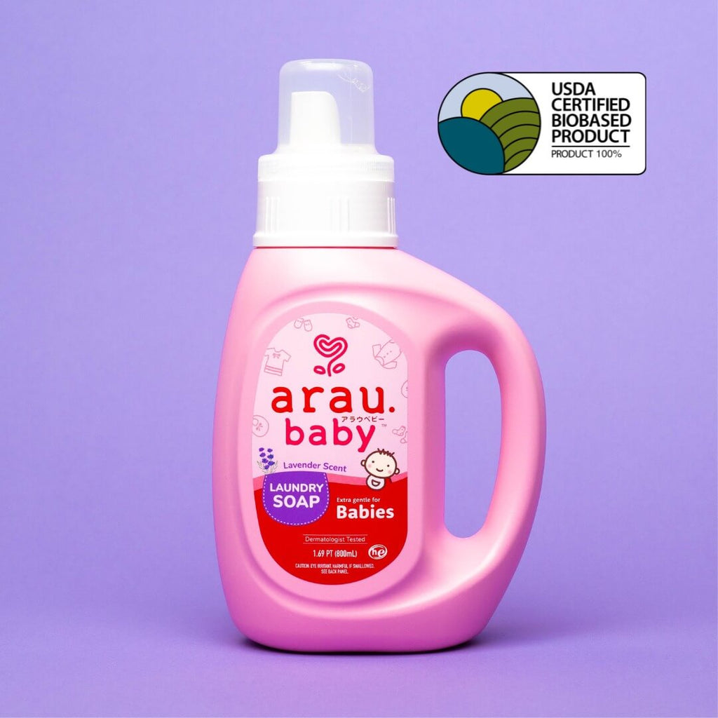 arau baby laundry soap bottle front over purple background